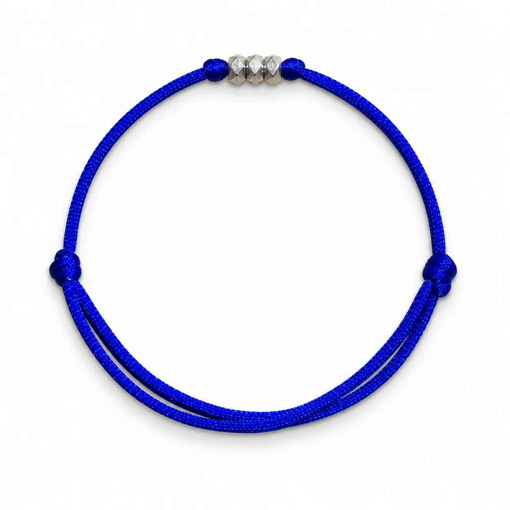 Adjustable blue cord bracelet with silver geometric beads