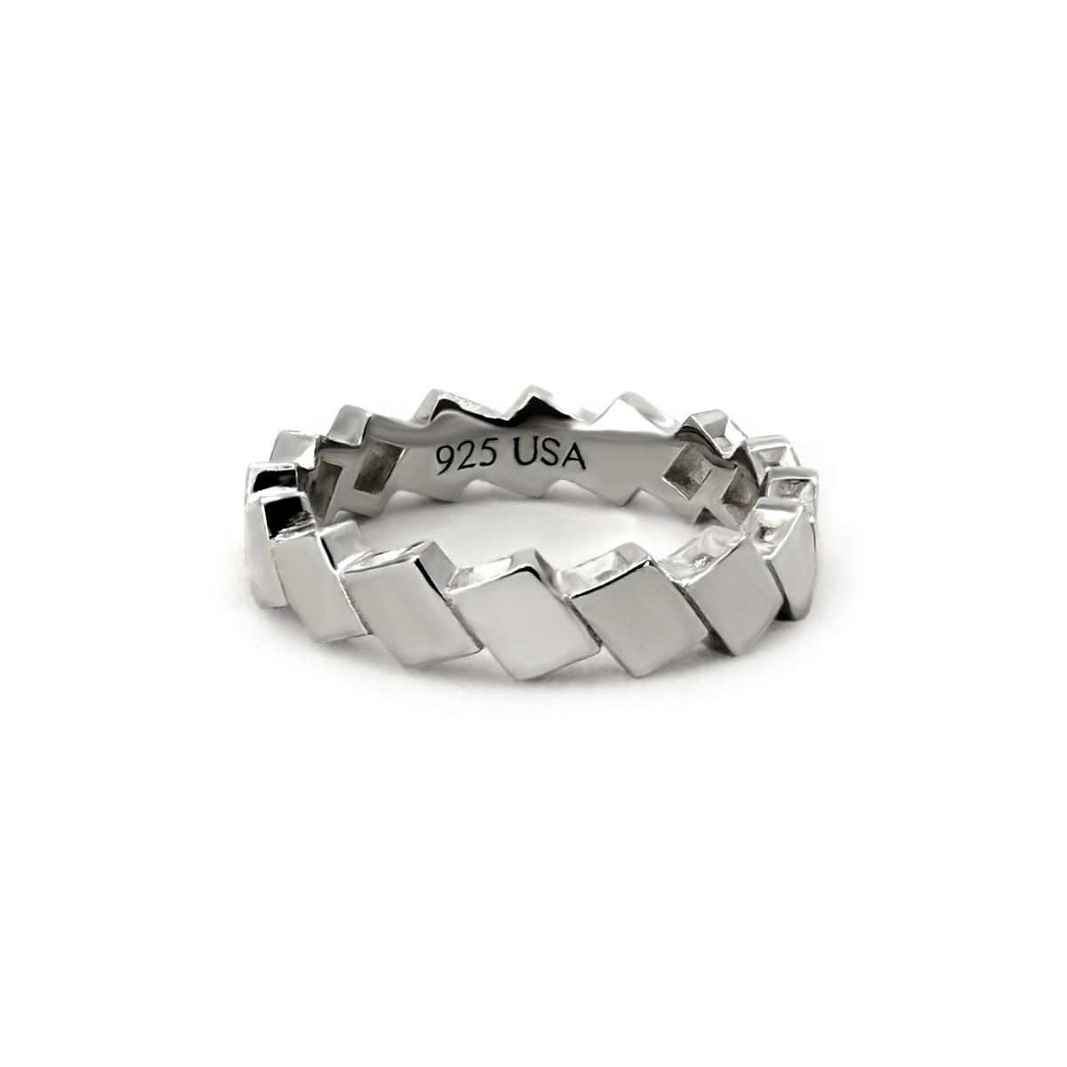Vela polished silver band with repeating diamond-shaped metal facets.