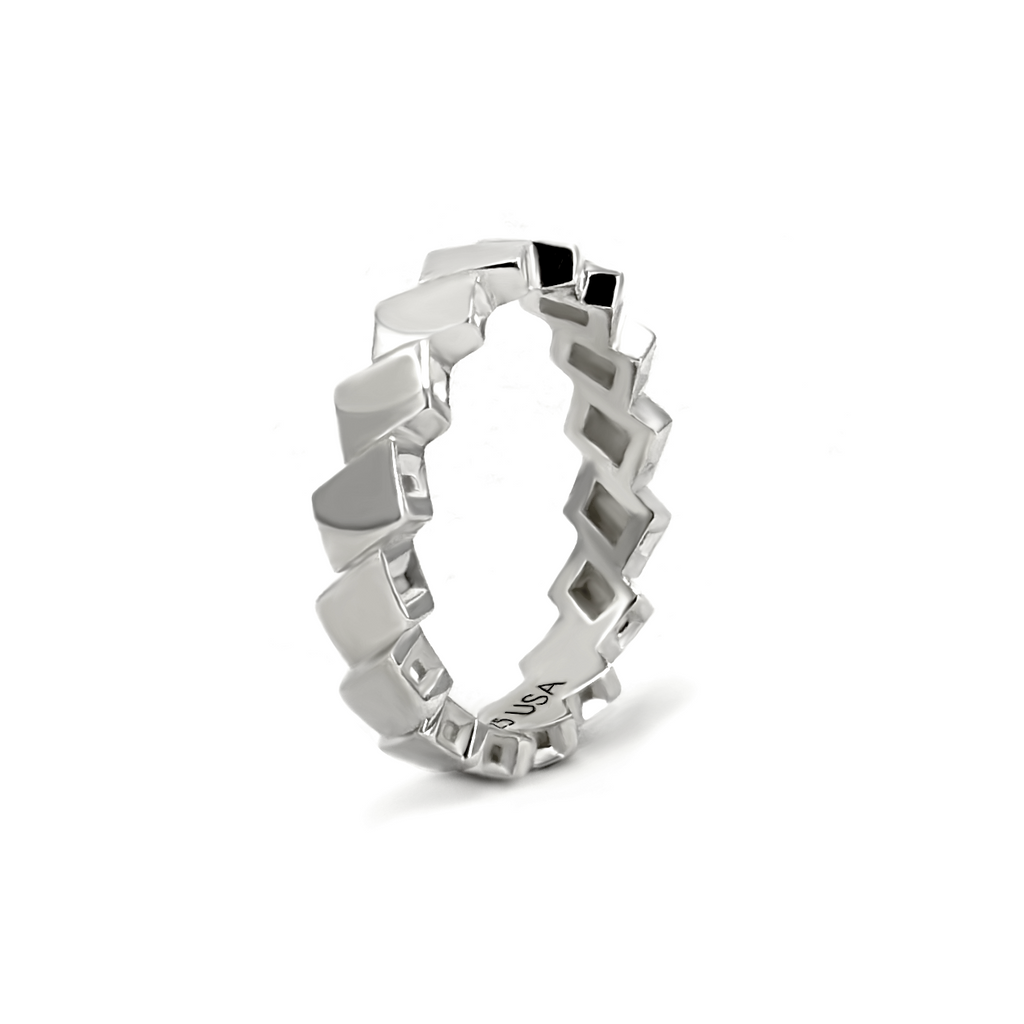 Vela polished silver band with repeating diamond-shaped metal facets.